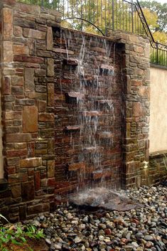 a water fall coming out of the side of a building