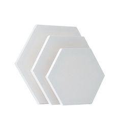 three white hexagonal plates sitting on top of each other