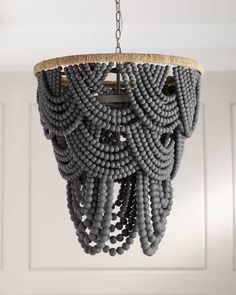 a gray chandelier hanging from a ceiling