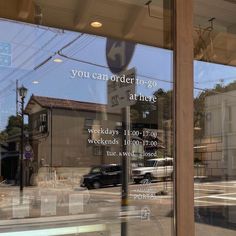 a car is parked in front of a window with the words you can order to go there