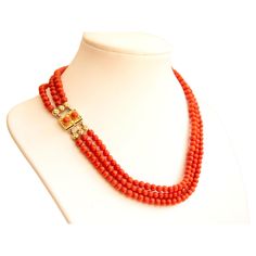 An antique necklace made of natural red coral beads with 14 karat golden clasp. The bracelet features three strands of round - shaped beads. The diameter of the beads is ca. 5 mm and the color is red. The clasp features a rectangular shape with two natural round red coral cabochon coral stones and a rope motif decoration. The clasp is stamped with 585 that stands for the 14 karat gold content. The necklacet is subtle yet eye catching and it suitable for daily or evening occasions. The condition Beaded Wedding Jewelry, Red Coral Jewellery, Gold Pearl Jewelry, Coral Beads Necklace, Gold Bridal Jewellery, Gold Bridal Jewellery Sets, Beaded Necklace Designs, Gold Wedding Jewelry, Black Beaded Jewelry