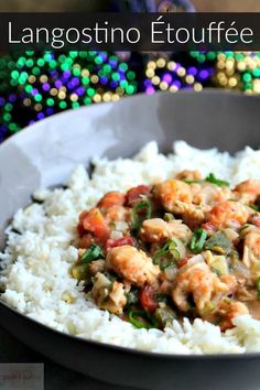 a bowl filled with rice and shrimp on top of a table next to colorful beads