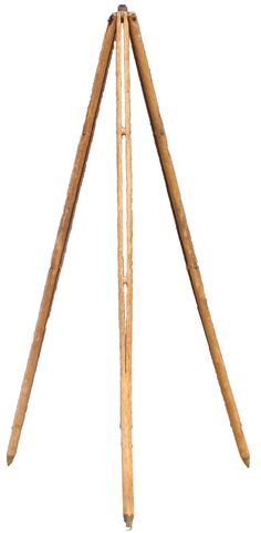 an old wooden tripod with three long sticks sticking out of it's sides