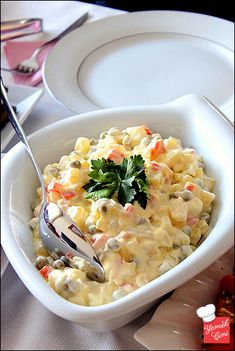 a white bowl filled with macaroni and cheese