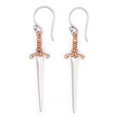 PRICES MAY VARY. Detailed Dagger Design: These mixed metal mini dagger dangle earrings, measuring 38x10mm, boast intricate details from point to pommel, capturing the fierce essence of a true dagger. Versatile Everyday Accessory: These sterling silver earrings are ideal for both daily wear and any magical occasion, effortlessly enhancing any outfit with a unique and fierce charm. 925 Sterling Silver: Made from 925 sterling silver, these earrings combine durability with environmental sustainabili Dagger Earring, Dagger Design, Dagger Earrings, Environmental Sustainability, Mixed Metal Earrings, Everyday Accessories, Small Earrings, Metal Earrings, Silver Earrings Dangle