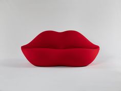 a red pillow shaped like a mouth on a white background