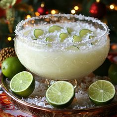 the margarita is garnished with limes and sugar