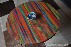 a colorful table with a bowl on it