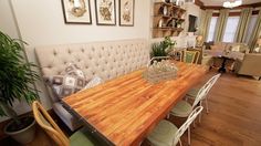 a wooden table sitting in the middle of a living room