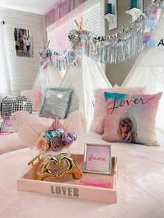 a bed with pink and gold decor in a bedroom decorated for valentine's day