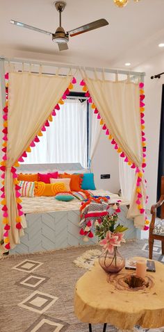 a living room decorated in bright colors and decorations