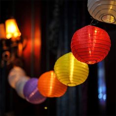 multicolored paper lanterns hanging from the ceiling