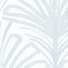 a blue and white wallpaper with palm leaves on it's back drop down