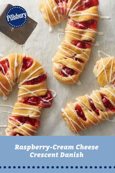 raspberry cream cheese crescent danish on a baking sheet with the words, raspberry cream cheese crescent danish