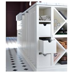 a white cabinet filled with lots of drawers