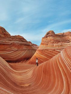 a person standing in the middle of an area that looks like it is made out of rock