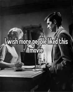 a man and woman sitting at a table with the words i wish more people liked this movie