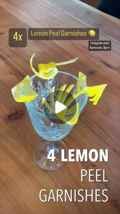 four lemon peel garnishments in a glass bowl on a wooden table with text overlay reading 4 lemon peel garnishes