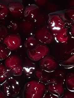 the liquid is being poured on top of cherries