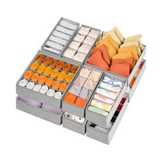 the drawers are organized with different types of fabric and other items in them, including oranges, yellows, and white