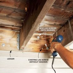 a man using a power drill to fix the ceiling