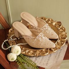 Beige Pointed Toe Mules For Party, Elegant Cream Mules With Low Heel, Elegant Cream Low Heel Mules, Summer Wedding Mules With Pointed Toe, Beige Block Heel Mules For Party, Beige Closed Toe Mules For Evening, Summer Wedding Pointed Toe Mules, Elegant Cream Mules For Party, Cream Embellished Heels For Summer