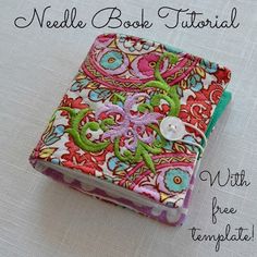 a small book with a button on it and the words needle book tutor written below