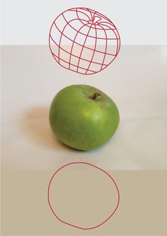 a green apple sitting on top of a white table next to a wire ball and circle