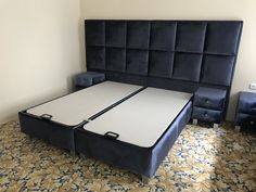 a bed with two mattresses on top of it