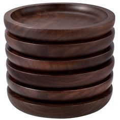 a stack of wooden plates sitting on top of each other