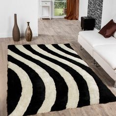 a black and white area rug in a living room