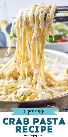 a fork full of crab pasta being lifted from a skillet with the title super easy crab pasta recipe