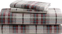 three plaid sheets stacked on top of each other