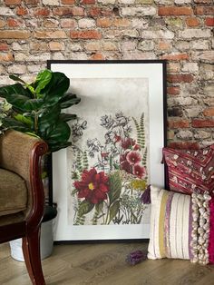 a room with a brick wall and some plants on the floor next to a chair