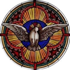 a stained glass window with a bird on it