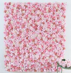 a wall made out of pink and white flowers