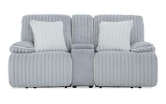 the reclining sofa has two pillows on it's back and is made out of fabric