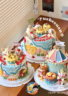 there are three cakes decorated with cartoon characters