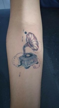 a tattoo with a record player on it