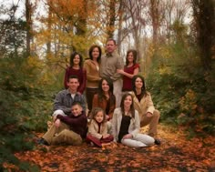 a family posing for a photo in the woods