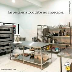 an industrial kitchen with stainless steel counters and appliances on the wall above it is a quote written in spanish