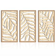 three wooden panels with leaves on them