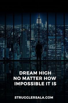 a man standing in front of a window with the words dream high no matter how impossible it