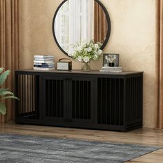 a living room with a large mirror on the wall next to a black console table