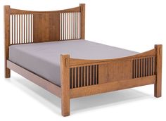 a wooden bed frame with slatted headboard and foot board on the side