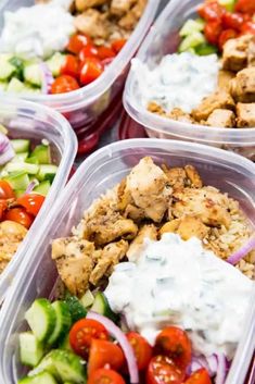 several plastic containers filled with different types of food