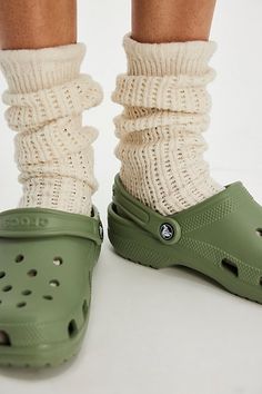 A cult classic, these effortless slip-on clogs from Crocs are featured in their instantly recognizable silhouette with a perforated upper, water-friendly design, and pivoting heel strap. **Features:** Slip-on style, lightweight, water-friendly and buoyant uppers, ventilation ports, pivoting heel strap, textured footbed, tread outsole **Why We | Crocs Classic Clogs at Free People in Green, Size: US 8 Croc Shoes Outfit, Heel Crocs, Green Crocs, Crocs Outfit, Crocs Clog, Crocs Clogs, Crocs Classic Clogs, Friendly Design, Crocs Shoes