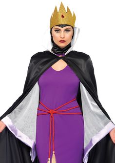 a woman in a purple dress with a crown on her head and cape over her shoulders