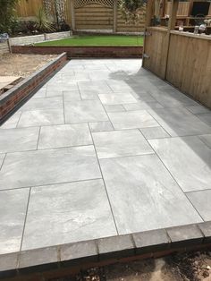 an outdoor patio that has been laid out and is ready to be used for landscaping