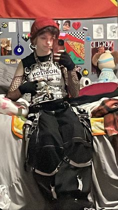 Trans masc guy wearing a bring me the horizon sleeveless shirt with fishnet sleeves, and black tripp pants with reflective straps and chains. Also wearing a red beanie and chains on his neck. Tripp Pants Outfit Men, Trans Ftm Outfit Ideas, Scene Outfit Inspo Masc, Alt Transmasc Outfits, Ftm Outfit Ideas, Ftm Summer Outfits, Transmasc Summer Outfits, Transgender Outfits Ftm, Masc Scene Outfits